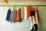 An artisan hangs dyed threads in Oaxaca that will make up MINNA's new textile collection.