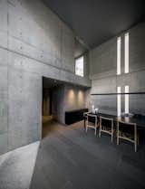 A single Japanese red pine tree provided the impetus to build this spartan, three-story dwelling and office designed by architect Go Fujita of Gosize in Nishinomiya, known as a prime site for Japanese cherry blossom sightings. Fashioned almost entirely of concrete, it has high ceilings and full walls that make way for select materials including tin, oak, and silver foil.&nbsp;
