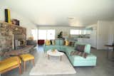 Take in all the retro vibes from this 1960s abode with decor to match. The home is minimalist, though peppered with curated books and midcentury furniture in fun tones like canary, cayenne, and Tiffany blue. Wraparound glass doors bring the outdoors in, while a breezeway and dining area complete with hammock and lounge chairs offers a soothing outdoor sanctuary.