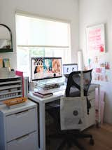 Office, Study Room Type, Chair, Desk, Medium Hardwood Floor, and Storage While initially only Danielle occupied the office for her design and art direction work, Bryan now shares the space with her. Here's a peek of her desk.   Photos from My House: How a Designer Couple Are Weathering the Pandemic in Their Berkeley Home