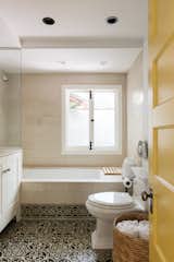 Mediterranean flair emanates from the bathroom with swirling tile under a soaking tub.
