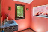The powder room, now a bright pink, has been painted a range of hues.