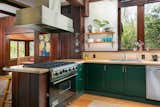 Freshly updated, the emerald-toned kitchen has a new Viking stove and range.
