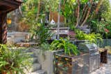 The barbecue in the backyard is built from Health Ceramics tile. The couple rented an SUV for to drive up to San Francisco and personally sort through seconds to bring back home.