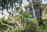The original white stucco facade was replaced with wood siding in 1968 by Matlin &amp; Dvoretzky.