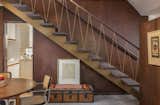 The staircase, with its delicate railing, was part of Douglas A. Brown’s original midcentury design.
