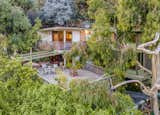 The deck is magical, resting above the treetops where you can hear the wind rushing through the trees. It is not a big lot, but the use of the space and enviable views make it feel open, and even grand, in its own way.