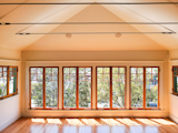 A myriad of windows let in plenty of natural light in this vaulted space.