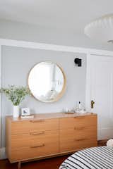 One of Gill's tips is to keep high traffic areas clutter free. Her Room and Board dresser is adorned intentionally with fresh flowers and a few items she uses regularly. Overhead is another Nelson Saucer Pendant Light.