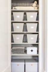 The linen closet is a sight to behold with dedicated storage bins from The Container Store so it's all clutter free. Even the Creative Co-op First Aid Kit matches the aesthetic.