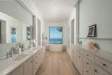 To summarize the primary suite in one word: spacious. The primary bath is teeming with storage and creature comforts; while an accompanying walk-in closet is a room in itself.  Photo 9 of 11 in A Santa Barbara Compound With Sweeping Panoramas Asks $19M