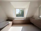 A Contemporary Villa in Belgium Comes Complete With a Landscape Pond and Showroom Garage - Photo 9 of 15 -