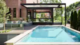 This $7.7M Classic Chicago Home Made of Limestone and Brick Hides a Striking Sunroom