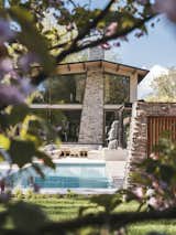 Exterior, House Building Type, Gable RoofLine, Stucco Siding Material, Green Roof Material, and Stone Siding Material Villa in the park, backyard pool  Photo 1 of 19 in Villa in the park by Jeroen de Nijs bni
