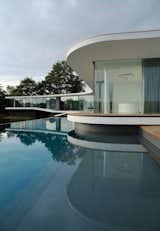 Outdoor, Trees, Infinity Pools, Tubs, Shower, Large Pools, Tubs, Shower, Large Patio, Porch, Deck, Concrete Pools, Tubs, Shower, Back Yard, and Wood Patio, Porch, Deck The infinity pool  Photos from White Snake house