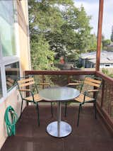 Cafe table and chairs on Loft balcony.