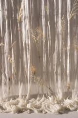 The Draped Flowers Curtain is "produced in a limited run of 30 pieces and every step takes place in a different small factory in Japan, each dedicated to its own unique craft and technique," says the studio.