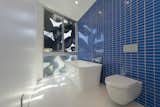 Glass-tile and porcelain bathroom