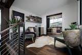 Words from Design Boss Gina:
This landing area off the master bedroom houses a coffee bar and work desk.  Photo 12 of 31 in MODERN MOUNTAIN HOME by Timothy Gormley