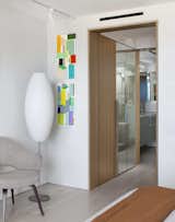 A cased opening leading from the master bedroom to the master bathroom and storage.