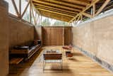 The pivoting panels, function as walls, door, security, and thermal barrier. They allow to open the house 100% towards the land and close in a hermetic way if required.
The two slopes roof rests on two wooden beams supported on the central walls of the house. This space constitutes the loft towards the best view of the area.  Photo 5 of 57 in Lasso House by JAG Studio