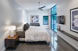 Bedroom, Table Lighting, Bed, Bench, Night Stands, Concrete Floor, Lamps, Ceiling Lighting, and Shelves  Photo 12 of 15 in Koser II by Neumann Monson Architects