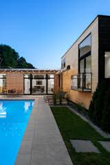 Outdoor, Hanging Lighting, Back Yard, Lap Pools, Tubs, Shower, Concrete Patio, Porch, Deck, Swimming Pools, Tubs, Shower, Hardscapes, and Grass  Photo 14 of 15 in Koser II by Neumann Monson Architects