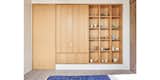 Guest bedroom rift & quartered oak closet, display shelving and door to storage.  