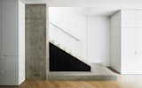 Staircase, Metal Railing, Concrete Tread, Glass Railing, and Wood Tread Stair  Photo 1 of 10 in Soldier Field House by Collective Office - Architects