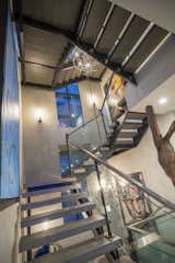 In a modern four-story home that emphasizes views, openness and artistry the choice to design floating stairs was an obvious one. KTGY used the stairs to celebrate the transition between all 4 levels.  The concrete levitating treads serve to reinforce the expansive feeling established in the home, offer a visual connection between spaces and allow light to flood the stairwell and the rooms beyond. Glass and metal handrails further push this theme of connectivity. These eye-catching stairs carry your eye upward and provide a gallery space for large pieces of art to be displayed and enjoyed.