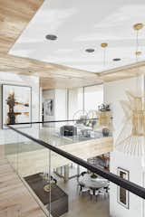 Hallway and Light Hardwood Floor Glass railings keep the home feeling open and allow light to flow unencumbered through the space.  Photo 7 of 9 in BUILDER Chōwa Concept Home by KTGY