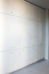 Cabinet storage wall in entry thoroughfare.