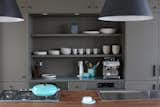 Shelf inserts to custom cabinets in kitchen.