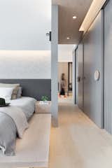 The custom-made cabinet wall with white washed oak panels and charcoal grey metal detail, resting in front of a striped backdrop. #studioadjective @studioadjective #apartment #home