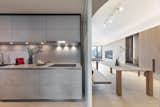 The custom-made cabinet wall with white washed oak panels and charcoal grey metal detail, resting in front of a striped backdrop. #studioadjective @studioadjective #apartment #home