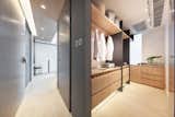 The custom-made cabinet wall with white washed oak panels and charcoal grey metal detail, resting in front of a striped backdrop. #studioadjective @studioadjective #apartment #home