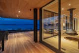 Doors, Sliding Door Type, Metal, and Exterior Floor to ceiling Marvin Modern sliding doors connect the interior and exterior of the building.  Photo 5 of 12 in CONTEMPORARY ISLAND HOUSE I by Taylored Architecture
