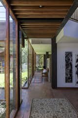 Hallway, Ceramic Tile Floor, and Concrete Floor  Photo 6 of 11 in La casa en la quebrada by DIEZ + MULLER ARQUITECTOS