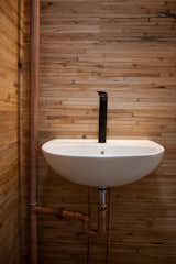 walls made from reclaimed boxcar flooring
