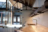 concrete and glass paired with natural edge, wood countertop and shelving