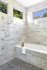 Bath Room, Engineered Quartz Counter, Porcelain Tile Floor, Drop In Tub, Full Shower, Ceiling Lighting, and Stone Tile Wall  Photo 18 of 20 in Barton Hills Residence by Brett Grinkmeyer
