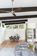 Living Room, Sofa, Sectional, Pendant Lighting, and Medium Hardwood Floor  Photo 6 of 20 in Barton Hills Residence by Brett Grinkmeyer