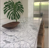 kitchen with a big island in marble (statuario from Italy)