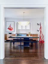 The dining room featuring custom millwork and a taco shaped light fixture