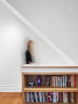 The cabinet pull detail was carried up to the ground floor at a credenza unit that disguised the guard for the stair to the lower suite