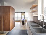 Kitchen, Slate Floor, Pendant Lighting, Undermount Sink, Light Hardwood Floor, and Wood Cabinet Facing east—natural light and framed views offer connections to the outdoors.  Photo 1 of 11 in Hazel Flat by Barbora Vokac Taylor Architect