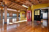 Living Room, Ceiling Lighting, and Medium Hardwood Floor 4,400 Square Feet of Living Space  Photo 2 of 14 in The American Bag Building Loft by Andy Read - Corcoran