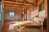 Bedroom and Medium Hardwood Floor Primary Bedroom  Photo 9 of 14 in The American Bag Building Loft by Andy Read - Corcoran