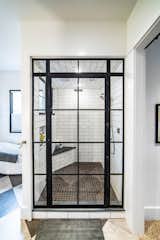 Bath Room, Concrete Wall, Enclosed Shower, Ceramic Tile Floor, Concrete Counter, Freestanding Tub, Subway Tile Wall, and Ceiling Lighting  Photo 7 of 19 in The Chicken Coop by Matt Patterson