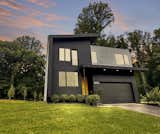 Exterior, Shingles Roof Material, Concrete Siding Material, House Building Type, and Flat RoofLine Modern piece of art  My Saves from Modern Twins
